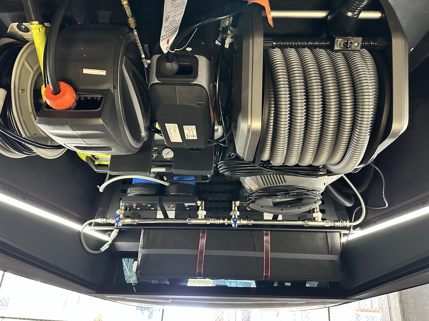 Cyberbeast truck bed with hose reels, plumbing, and LED work lighting